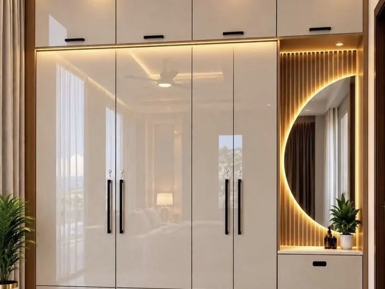Grey glossy wardrobe wall with gold handles and display niches.